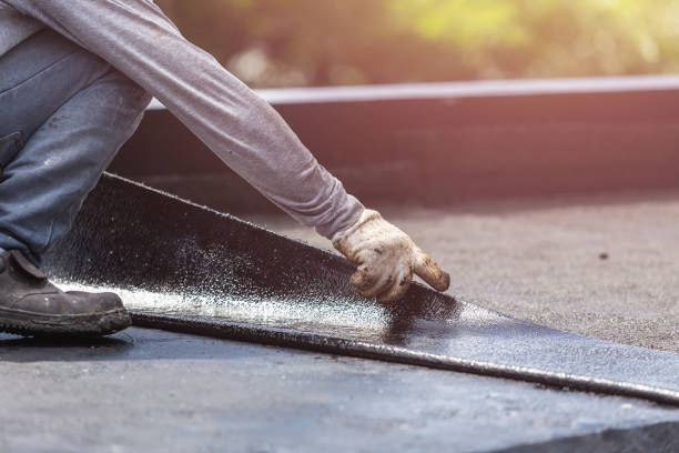 Professional Waterproofing technician working in Winfield, KS